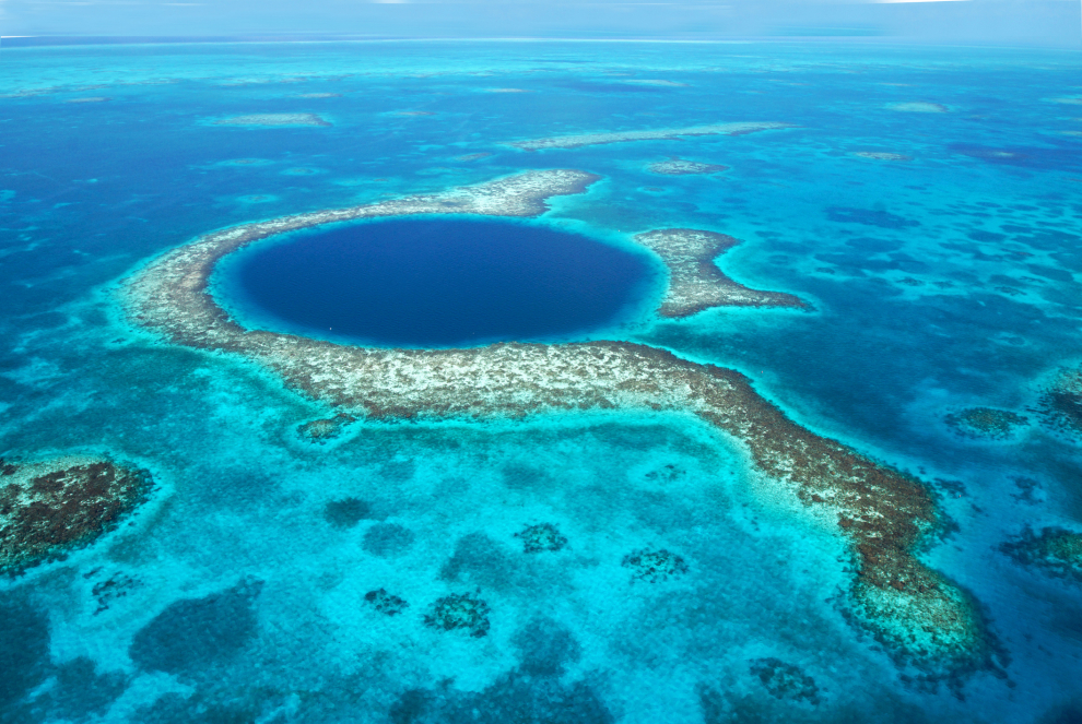 Belize's attractions are similar to those of Mexico in many aspects, such as gastronomy or Mayan archaeology, although it is distinguished by its Caribbean influence, more heterogeneous due to its mix of cultures, religions and ethnic diversity.  Its barrier reef is one of the most diverse ecosystems in the world that has hundreds of species of corals and fish of all sizes and colors.  The Gran Cenote Azul (in the photo) is one of its main tourist icons.